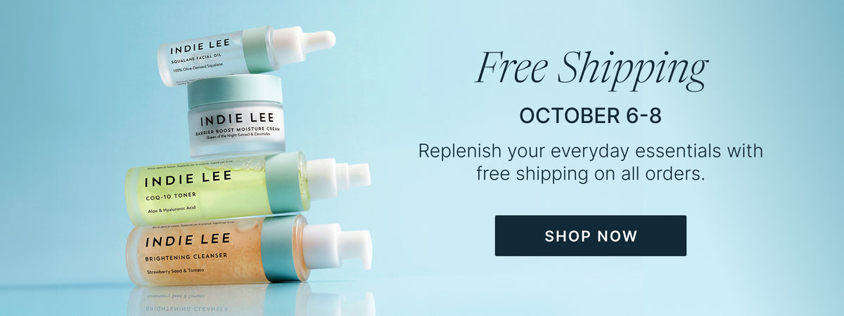 Four stacked Indie Lee skincare products in white, pale yellow, and peach tones on a light blue background, with promotional text reading 'Free Shipping' and a 'SHOP NOW' button.