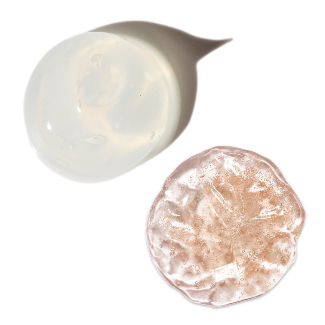 Swatches of Indie Lee facial cleansers on white background