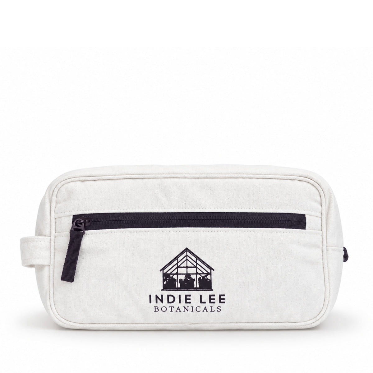 A white Indie Lee cosmetic bag set against a white background