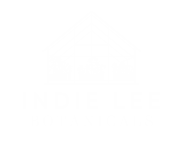 Silhouette of a greenhouse with 'Indie Lee Botanicals' in text below