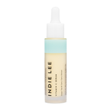 Bottle of Indie Lee Vitamin C Serum on a white background