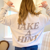 Woman wearing Indie Lee "Take A Hint" Sweatshirt