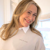 Woman wearing Indie Lee "Take A Hint" Sweatshirt