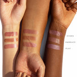 Swatches of Indie Lee Nourishing Lip Tint on a variety of skin tones