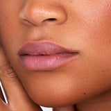 Woman wearing Indie Lee Nourishing Lip Tint