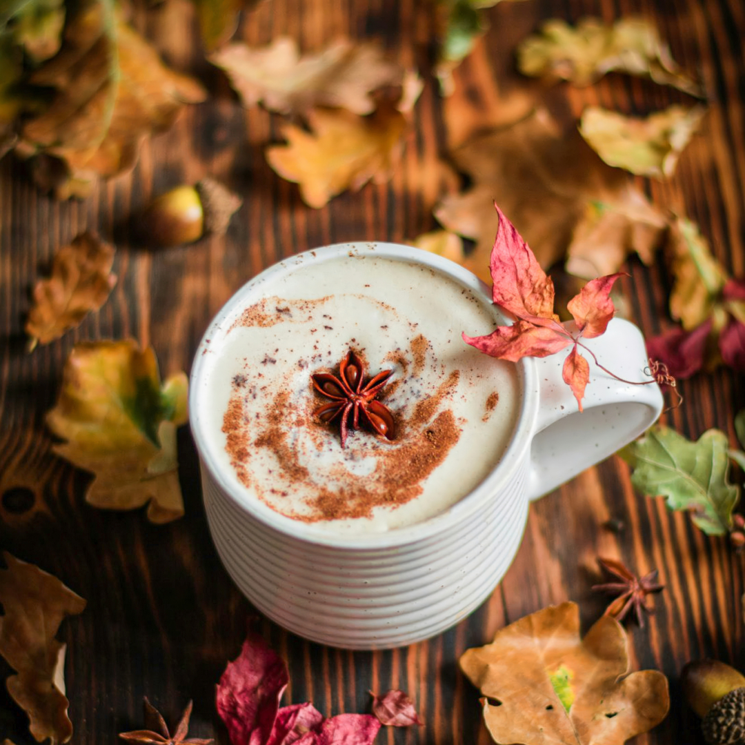 Coffee cup with autumn leaves