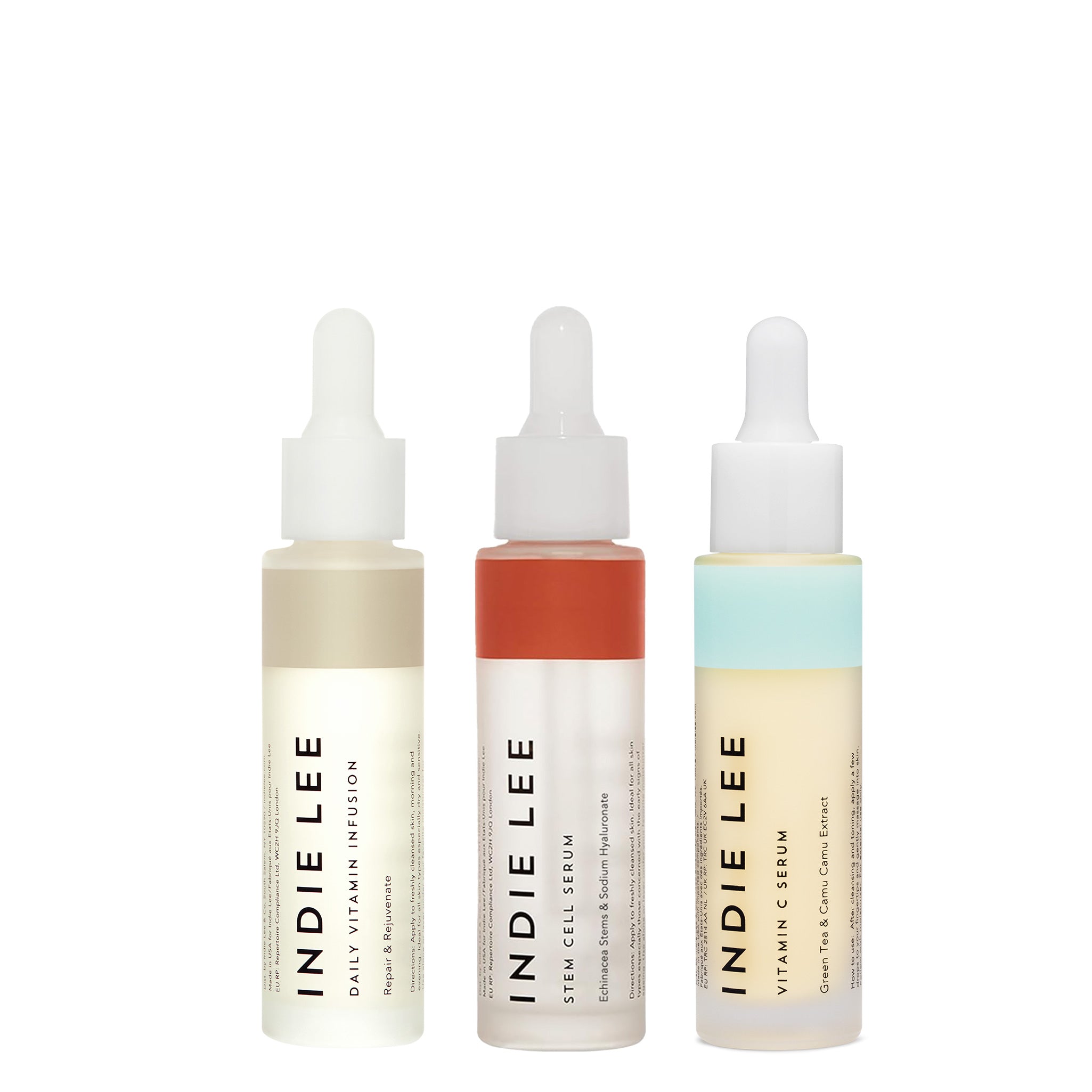 Three bottles of Indie Lee skincare products on a white background