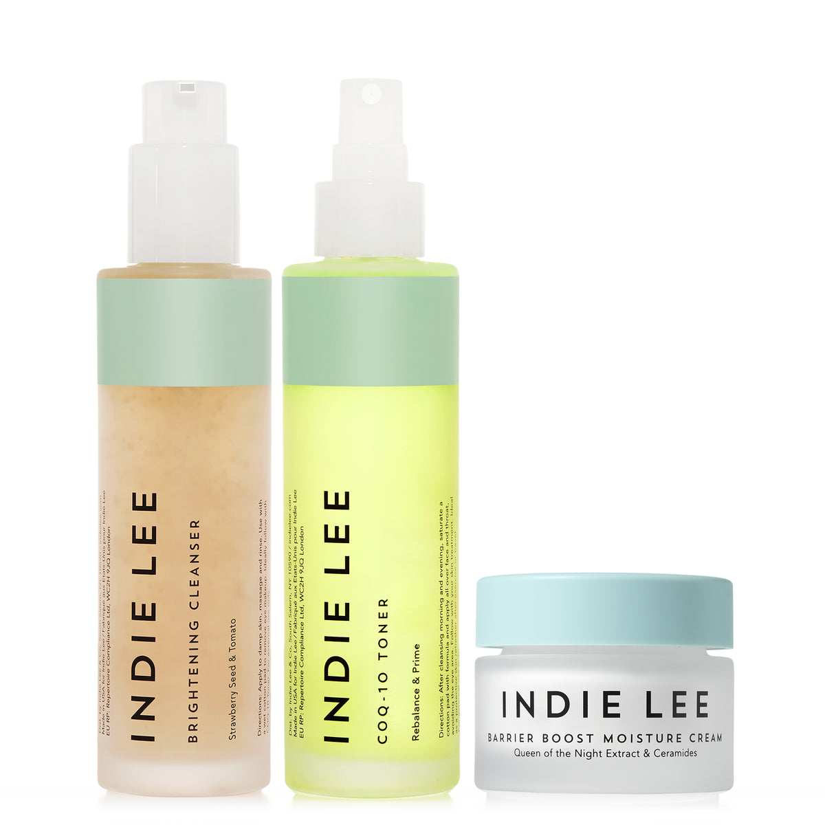Three Indie Lee skincare products on a white background: a Brightening Cleanser bottle, a COQ-10 Toner spray bottle, and a Barrier Boost Moisture Cream jar.