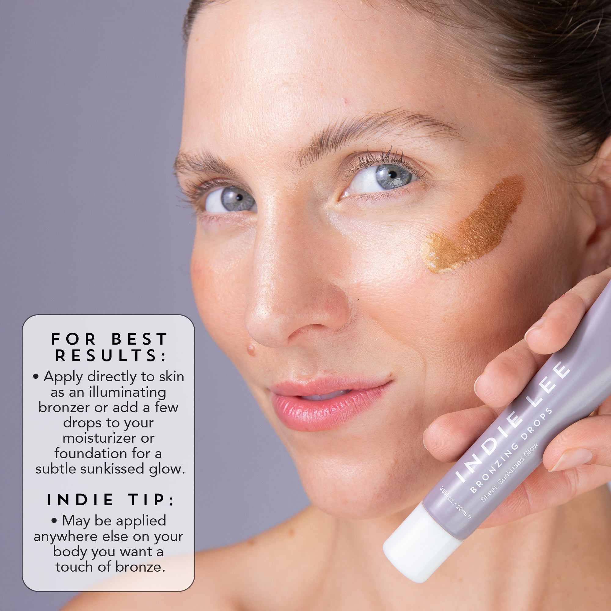 Woman applying Indie Lee Bronzing Drops to her face with text on how to use it.