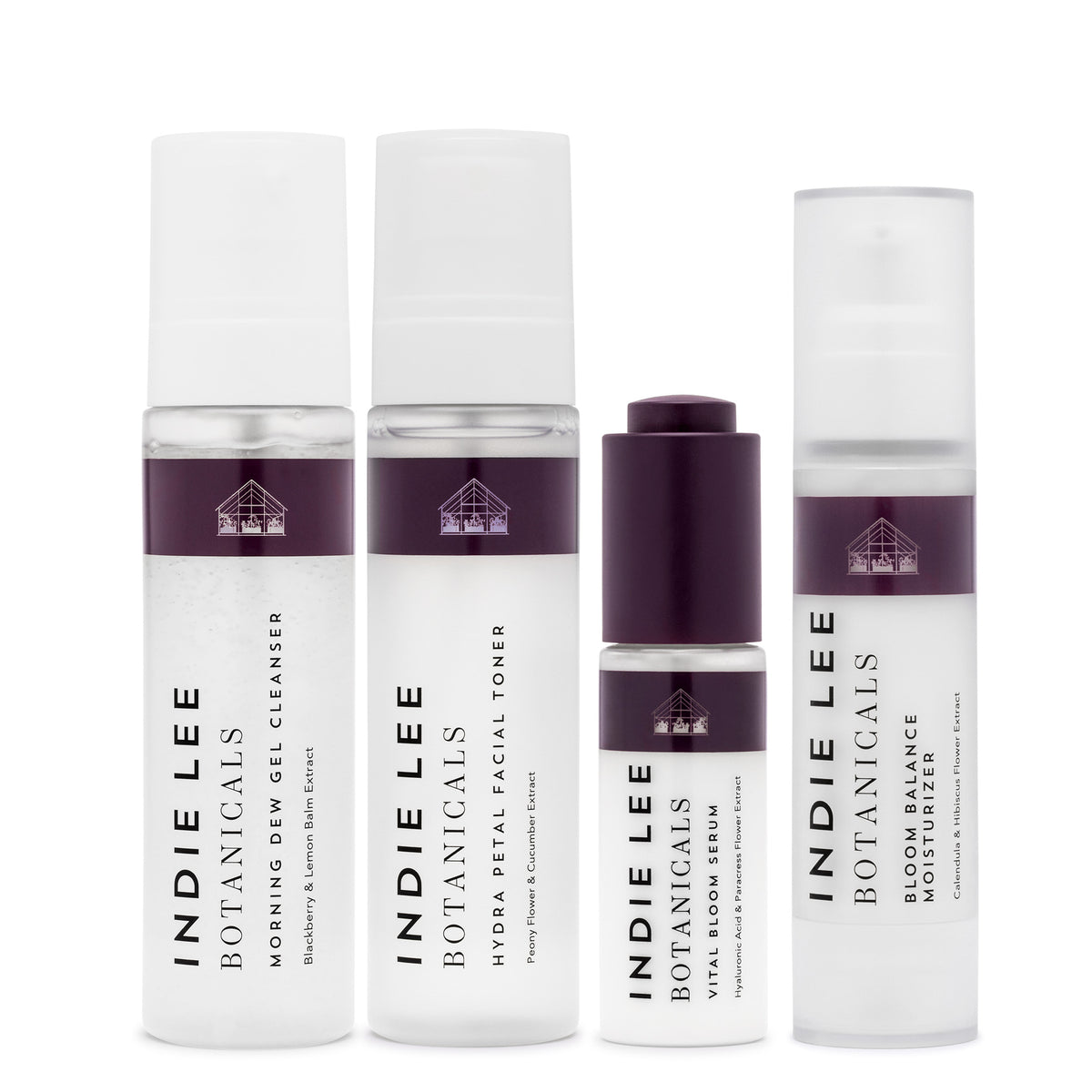 Indie Lee bundle with four bottles of skincare set against a white background
