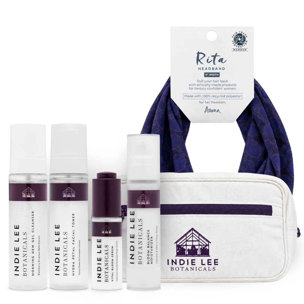 Indie Lee bundle including four bottles of skincare, a blue headband, and a makeup bag set against a white background