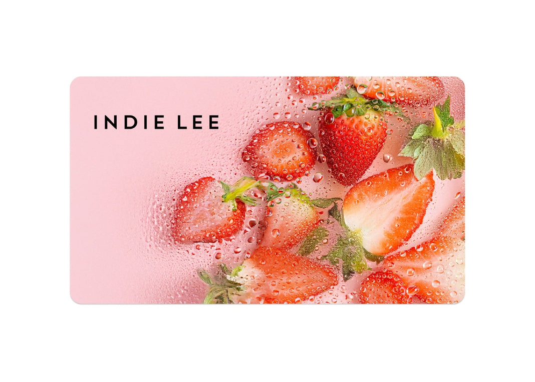 Indie Lee virtual gift card with strawberries on a pink background