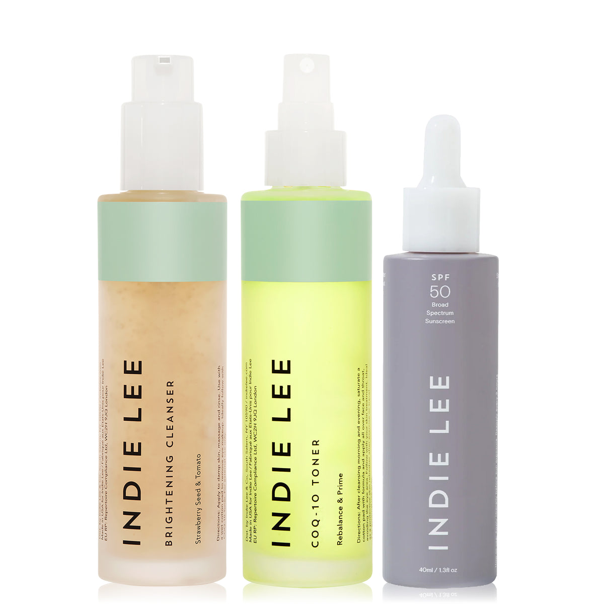 Set of 3 bottles of Indie Lee skincare products on a white background