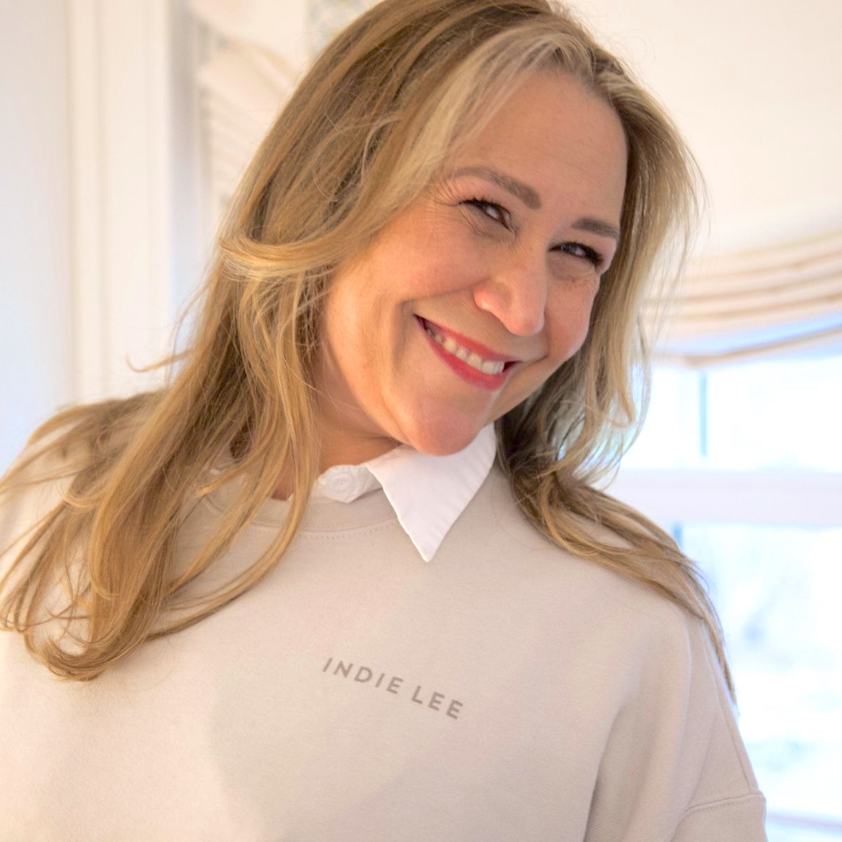 Woman wearing Indie Lee "Take A Hint" Sweatshirt